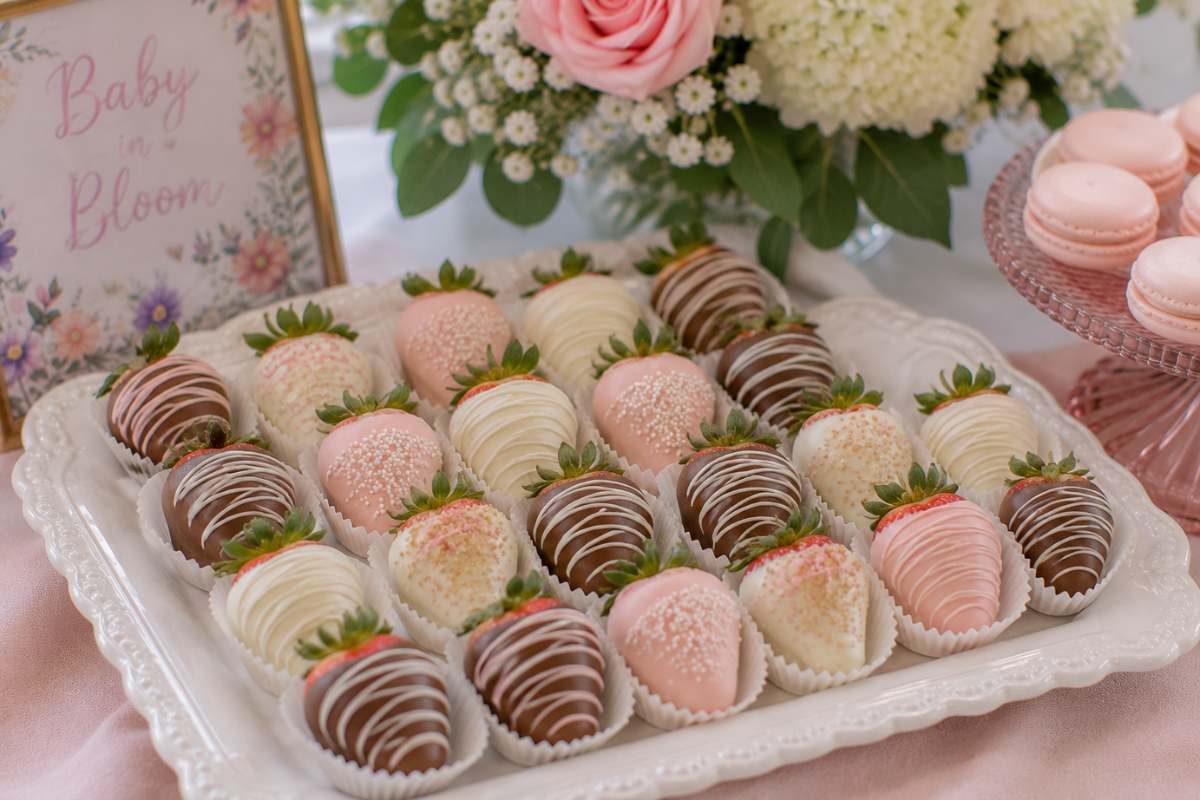White, milk, and dark chocolate-covered strawberries decorated with pastel drizzle and sprinkles for an elegant baby shower dessert.
