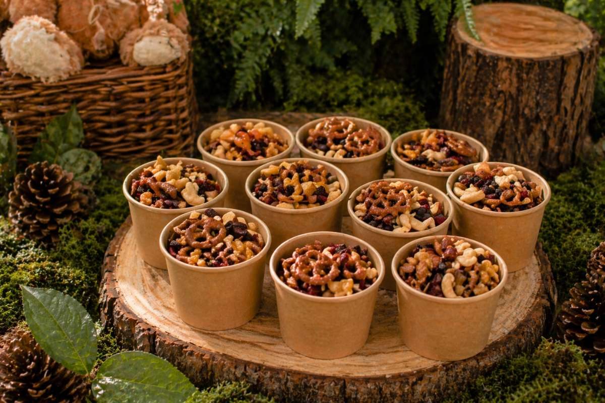 Woodland baby shower trail mix snack cups with nuts, pretzels, and dried fruits
