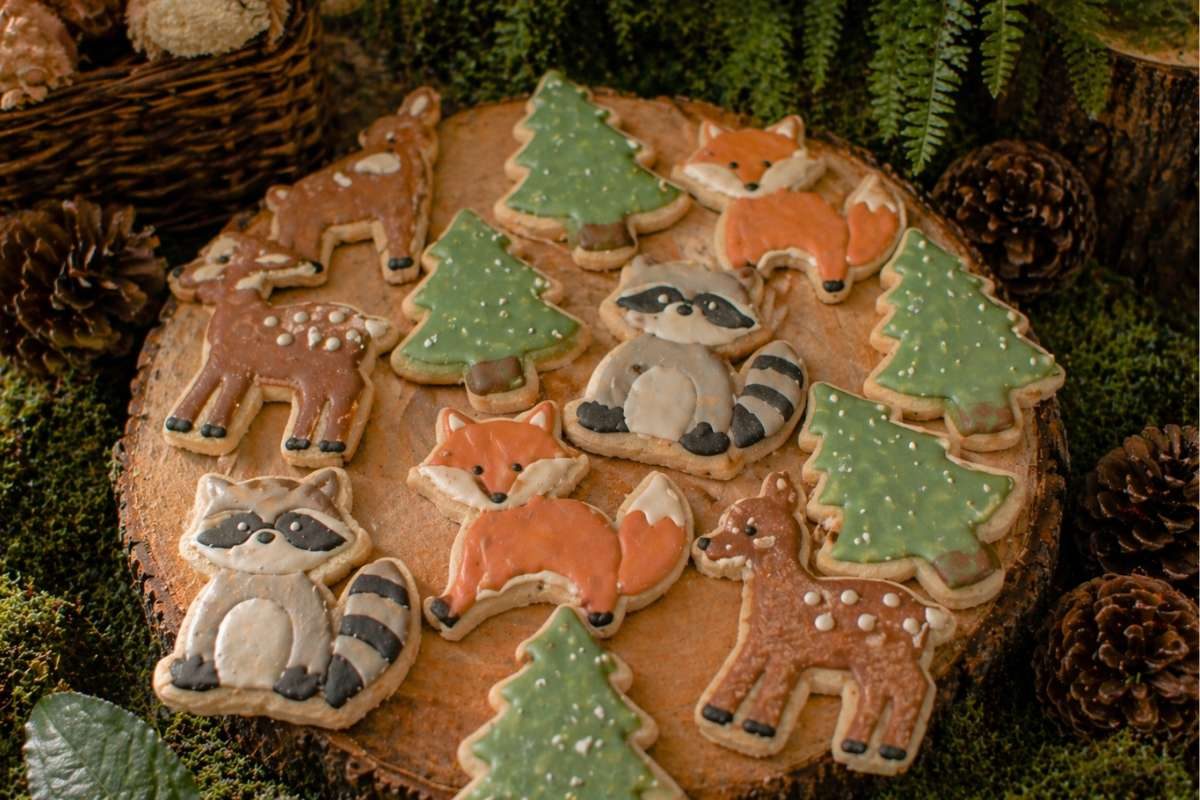 Woodland sugar cookies shaped like foxes, raccoons, deer, and pine trees